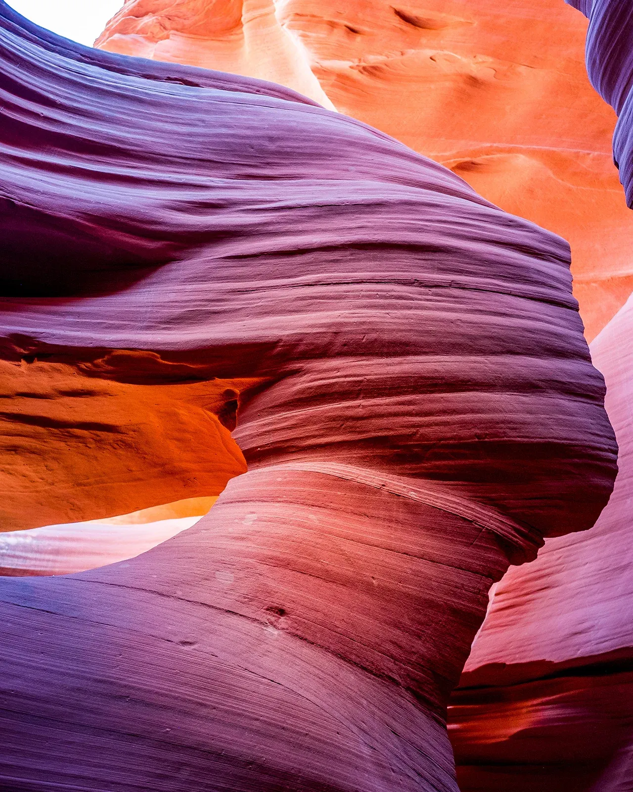 Violet light in a Navajo slot canyon formation called Lady in the Wind, Arizona